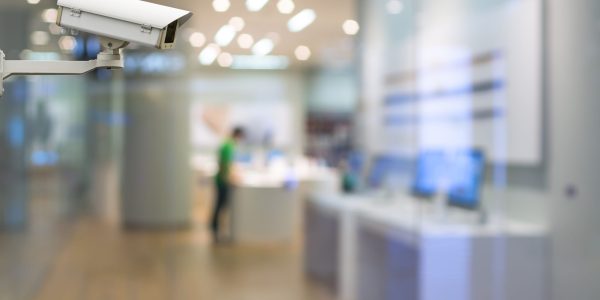 CCTV security camera on monitor the abstract store blurred in hall with bokeh background