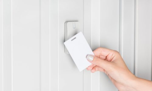 person opening door with electronic card, home security concept