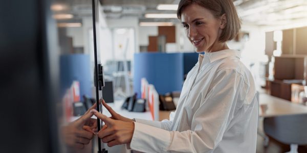 Woman entering password or PIN code to unlock and access security door at office. High quality photo